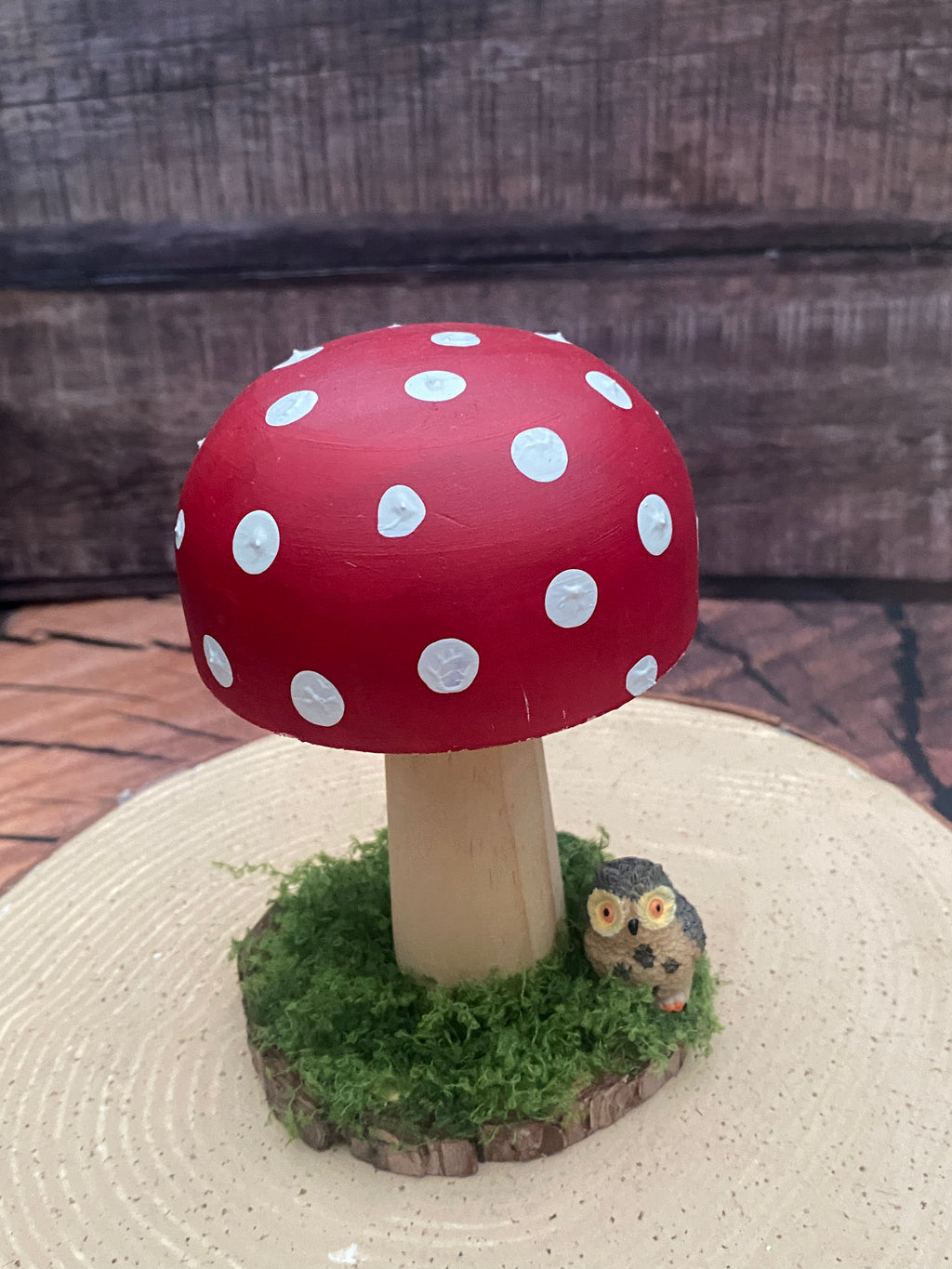 Medium red and white mushroom with owl