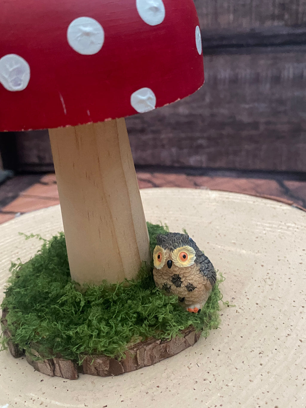 Medium red and white mushroom with owl