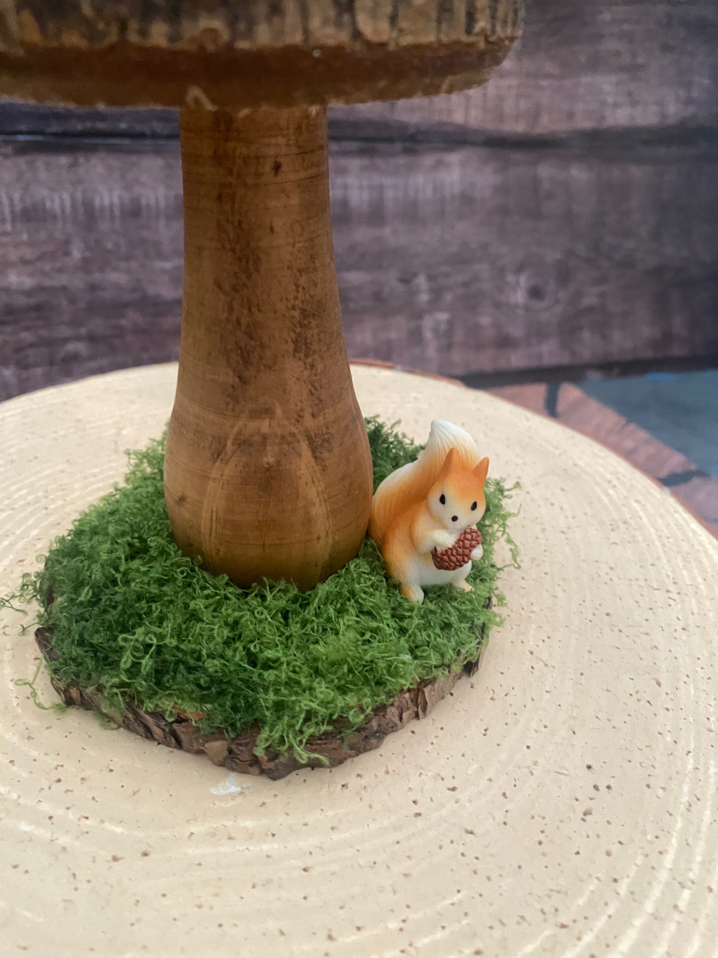 Natural wooden mushroom with squirrel