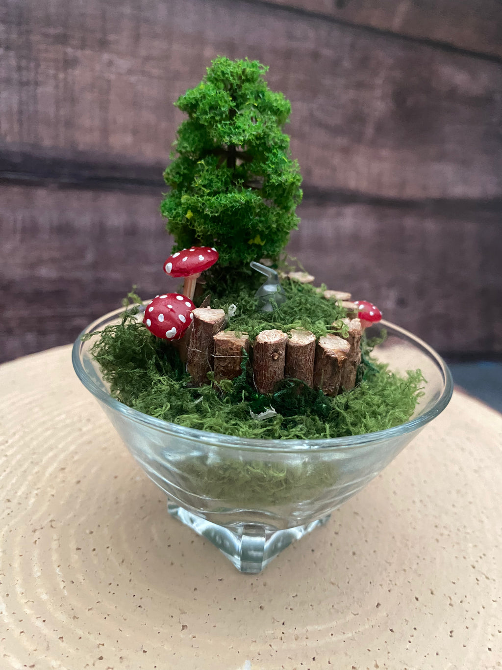 Flameless candle in smaller mossy forest scene