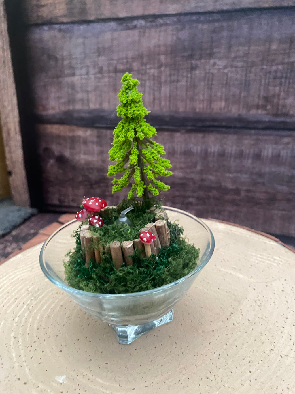 Flameless candle in smaller mossy woodland scene