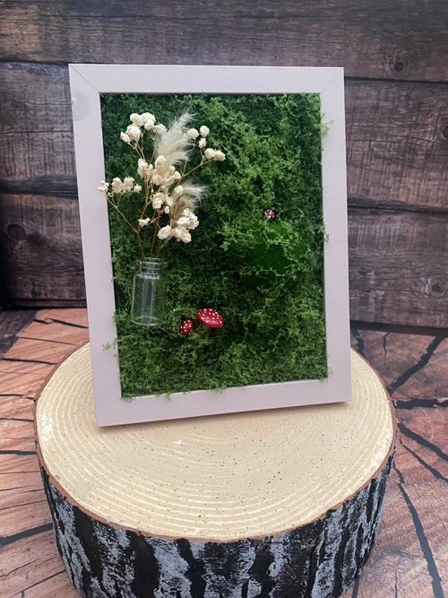 3D mossy scene with pink frame