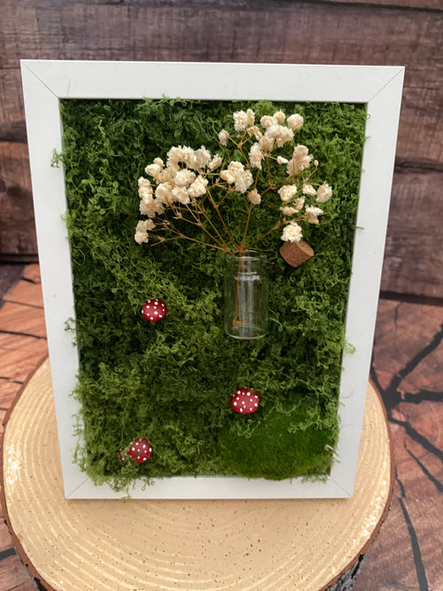 3D mossy scene with white frame
