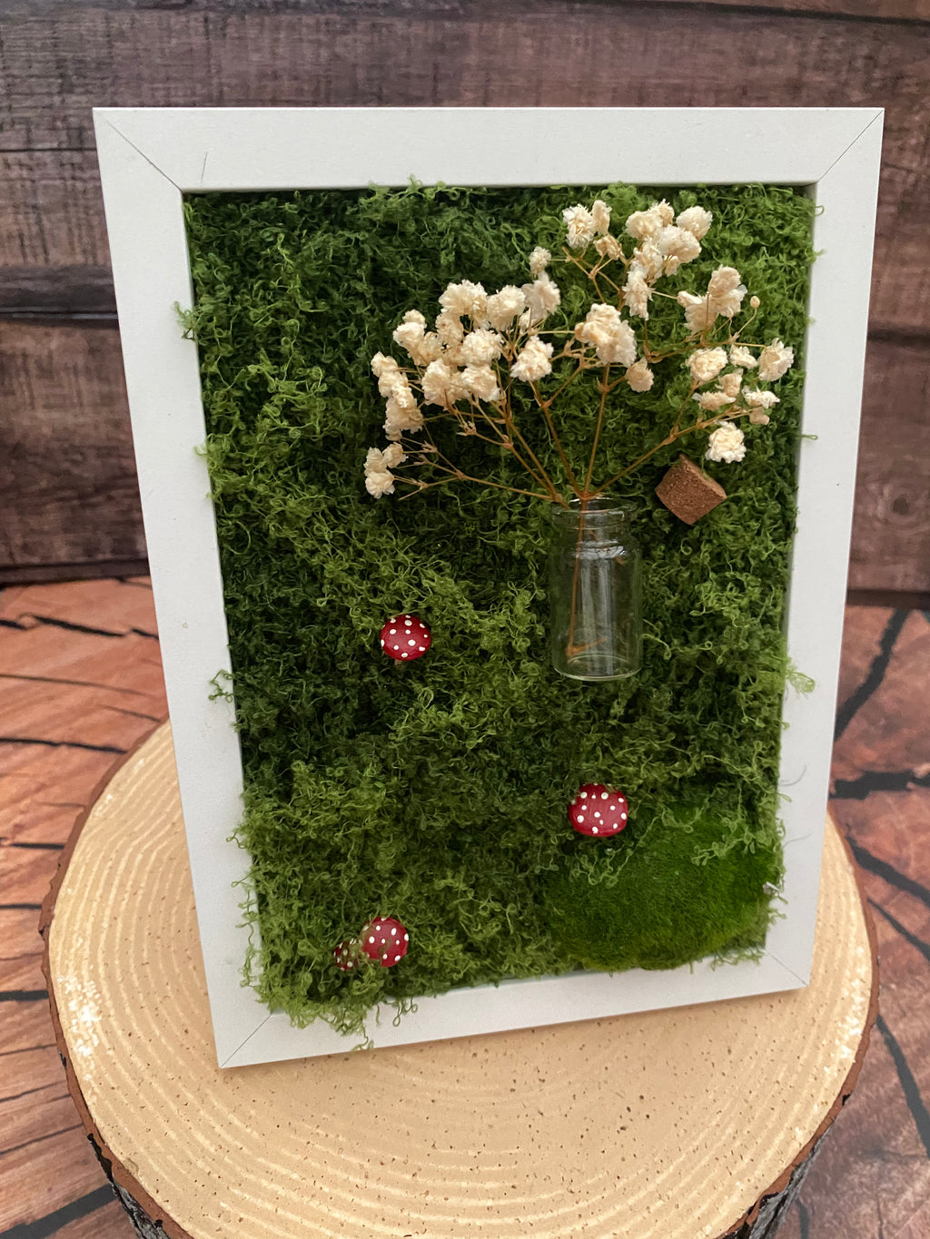 3D mossy scene with white frame